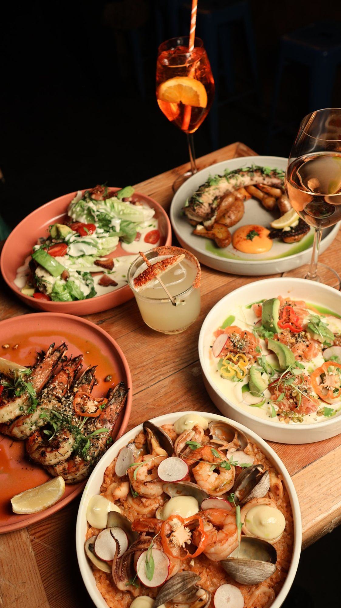 Salmon tartare, grilled octopus, Caesar salad and cocktails